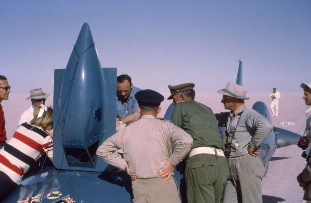 Campbell discusses problems with the track to his team.
